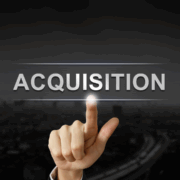 business hand pushing acquisition button